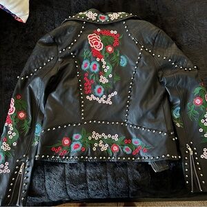 L’ATISTE embroidered faux leather jacket.